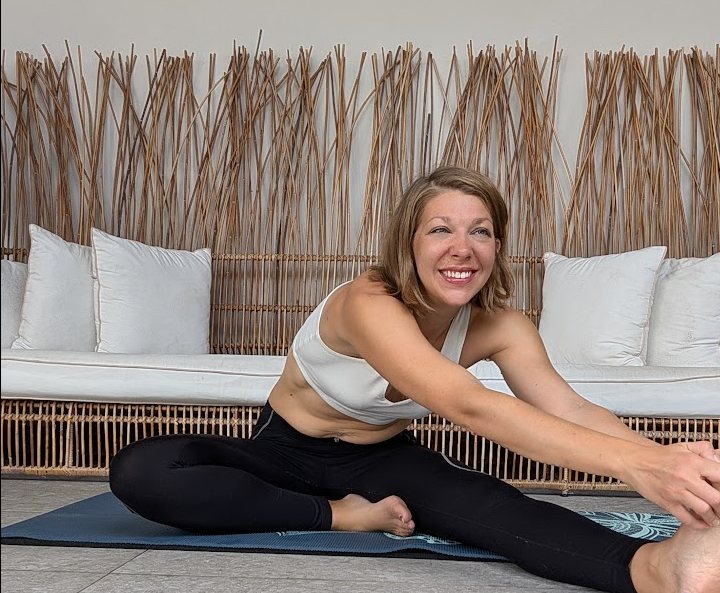 Woman doing somatic movement in a bright Atlanta wellness studio